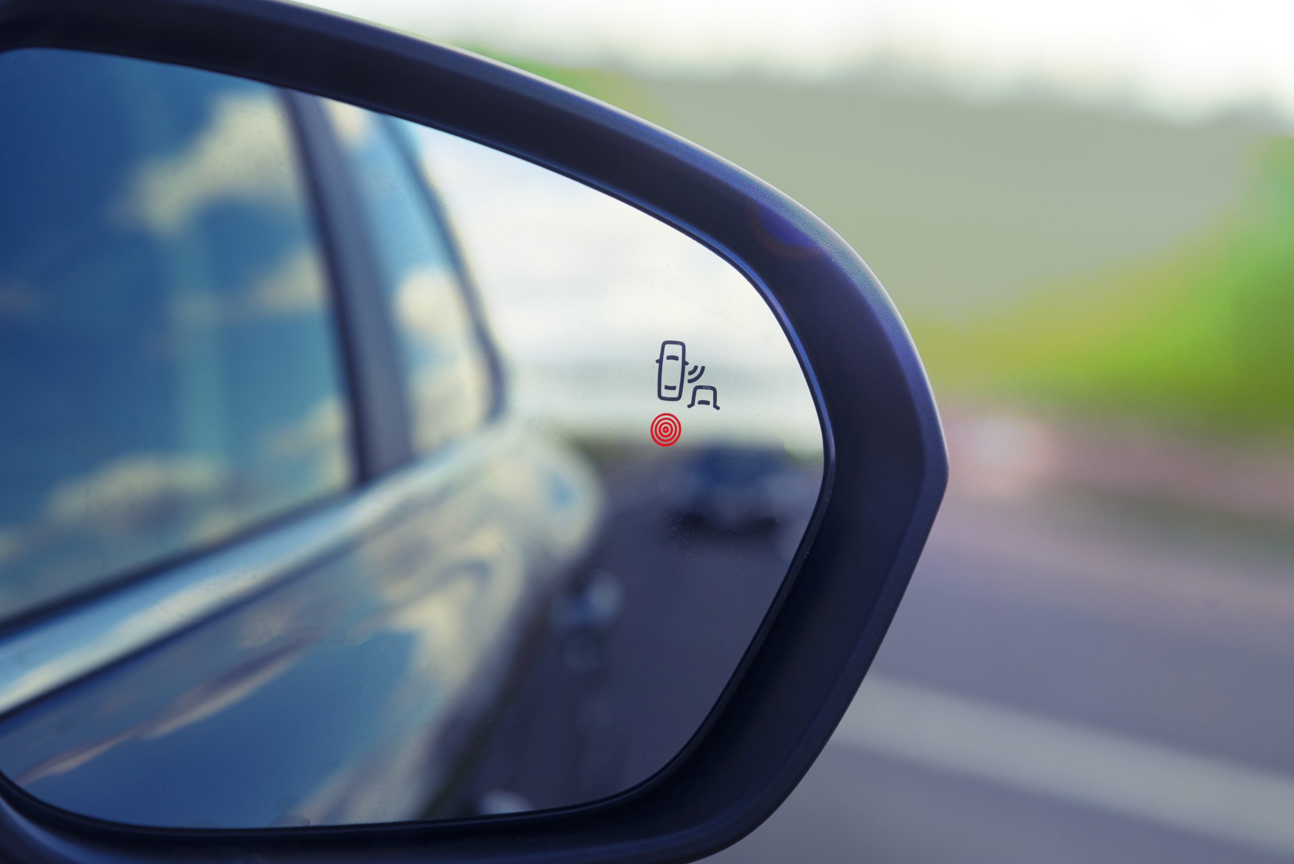 blind-zone-monitoring-sensor-side-mirror-modern-car-scaled.jpg