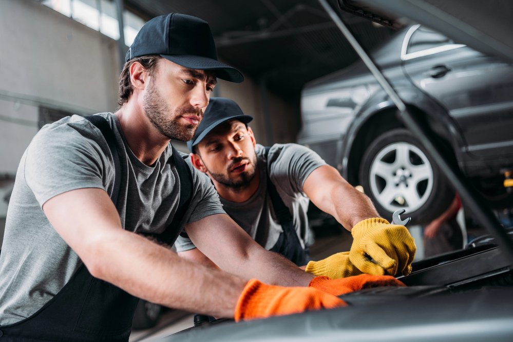 Mechanics-technicians-working-on-car-Depositphotos_204693012_S.jpg